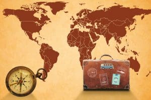 A map of the world with a clock and suitcase.