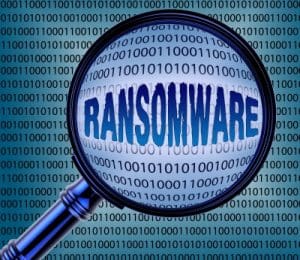A magnifying glass over the word ransomware.