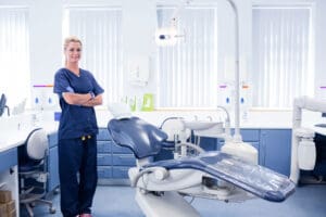 A dentist standing in front of an operating room.
