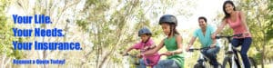 Two children riding bikes in a park with trees